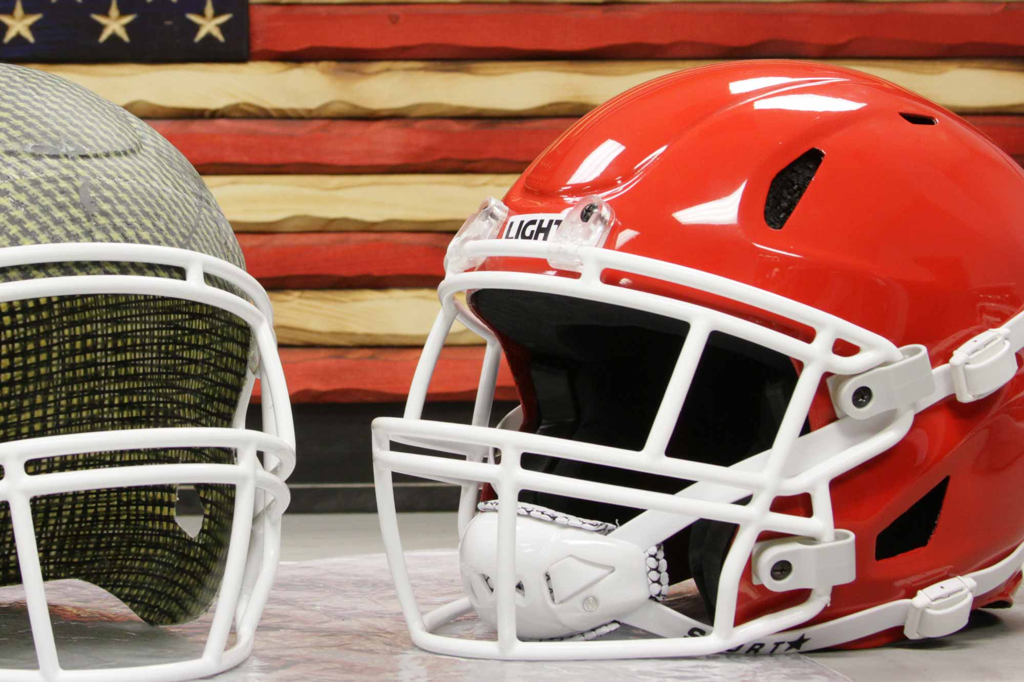 Two LIGHT LS2 Football Helmets with the American Flag background