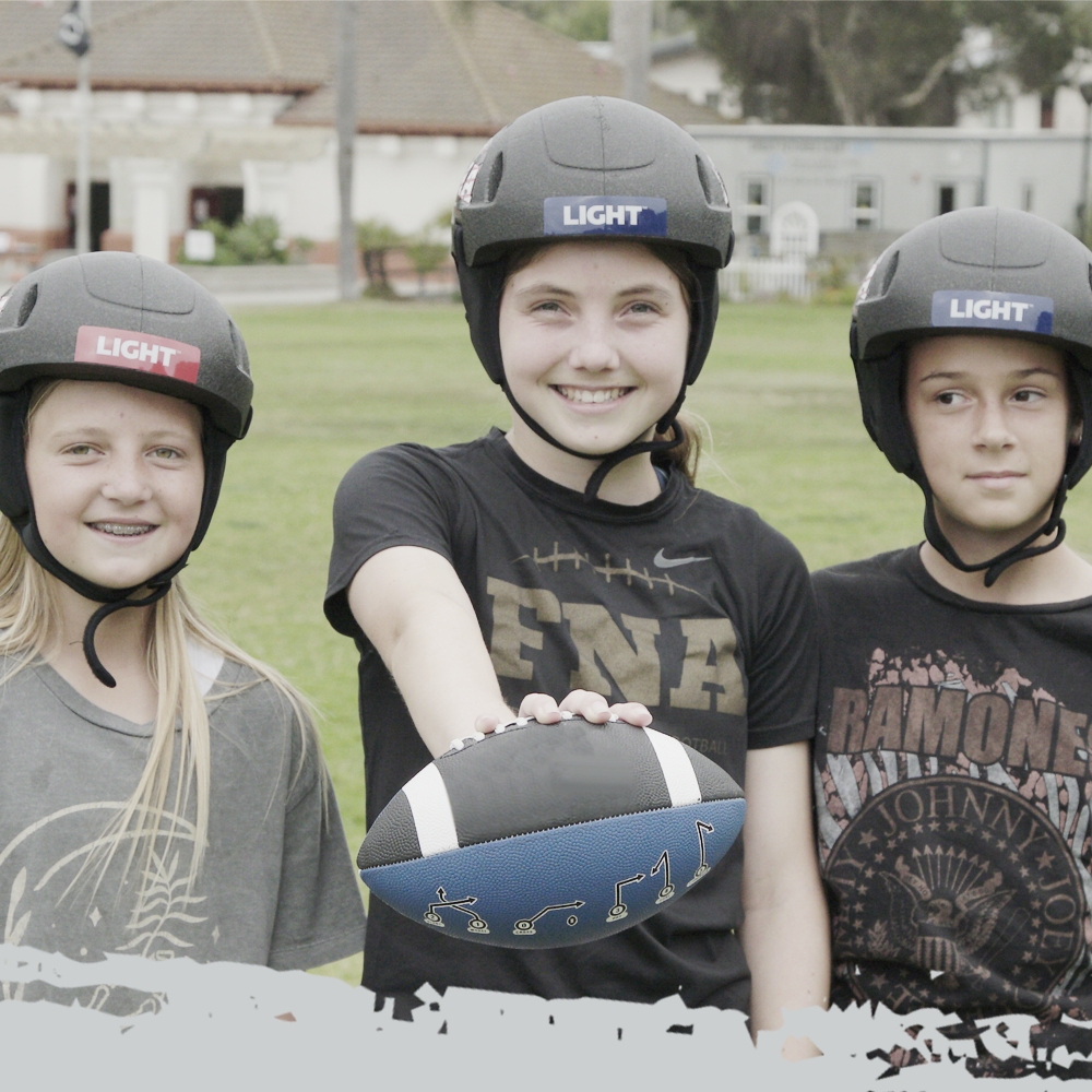 Three Girl Flag Football Players wearing a Black LIGHT SS1 Helmet
