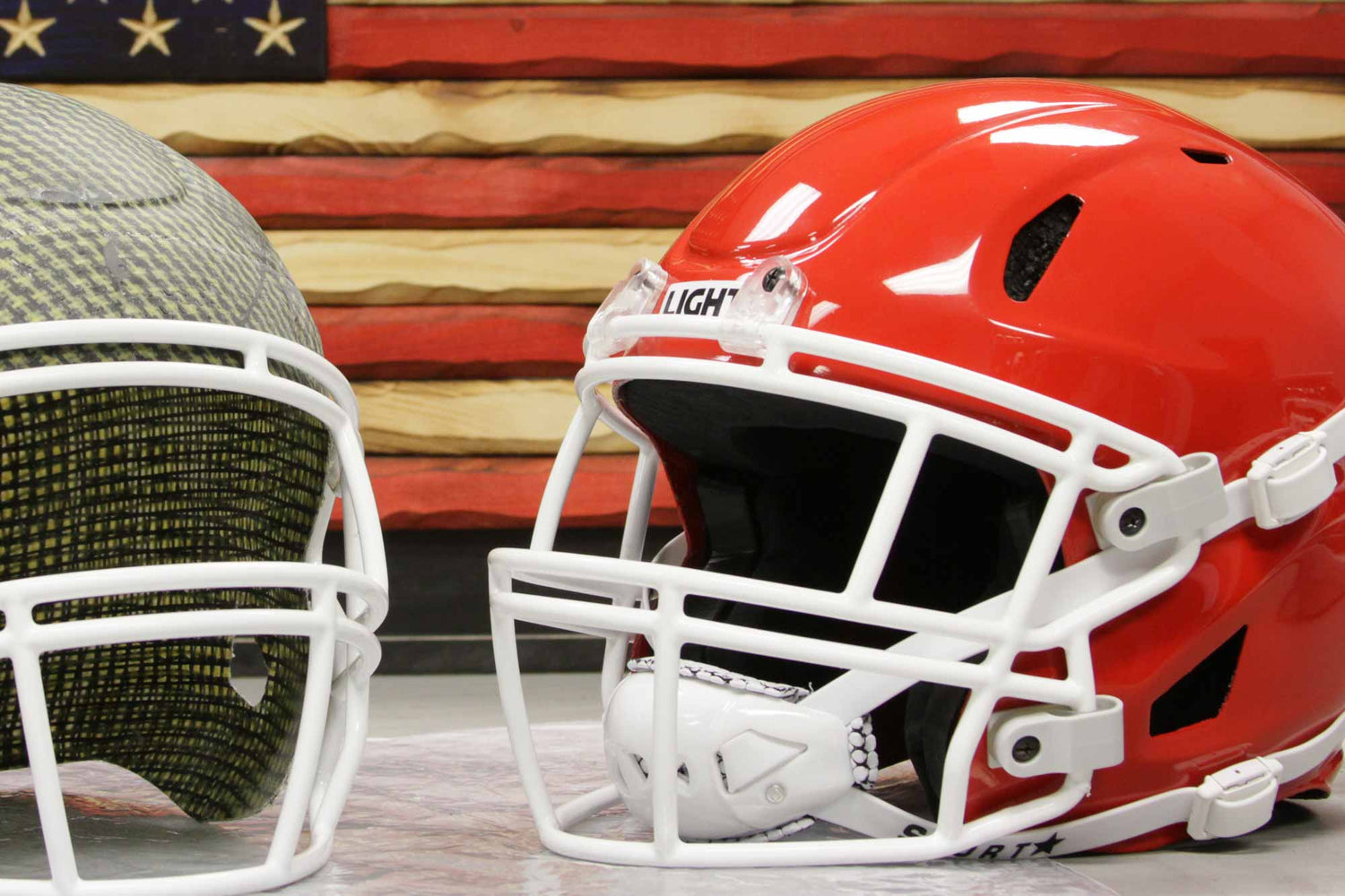 Two LIGHT LS2 Football Helmets with the American Flag background 