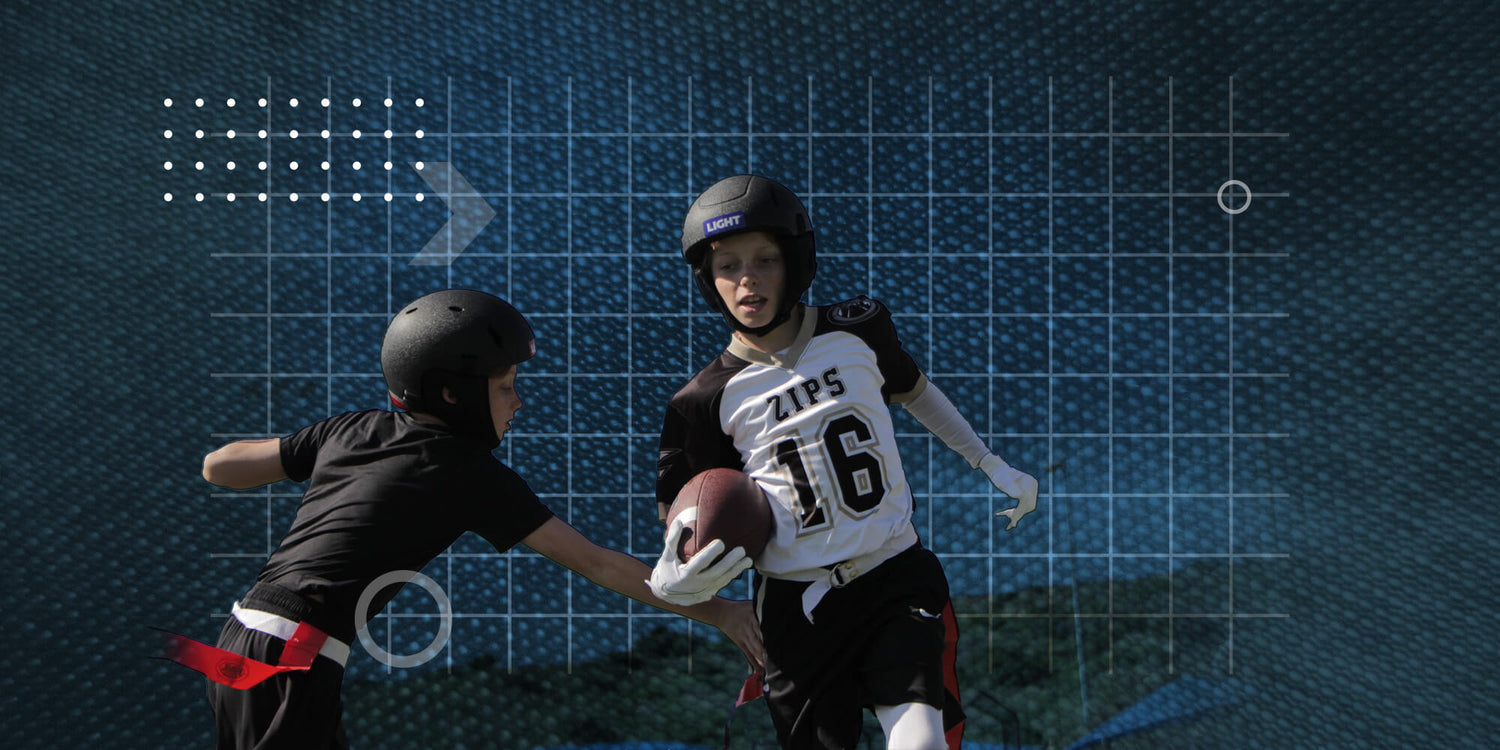 Two kids playing flag football wearing LIGHT SS1 Helmets